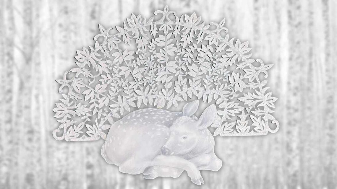 A graphite pencil sketch of a fawn sleeping in front of a large leafy, lacy fan of cut paper